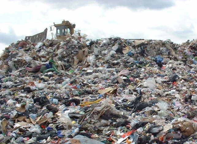 A compactor working on the daily waste cell